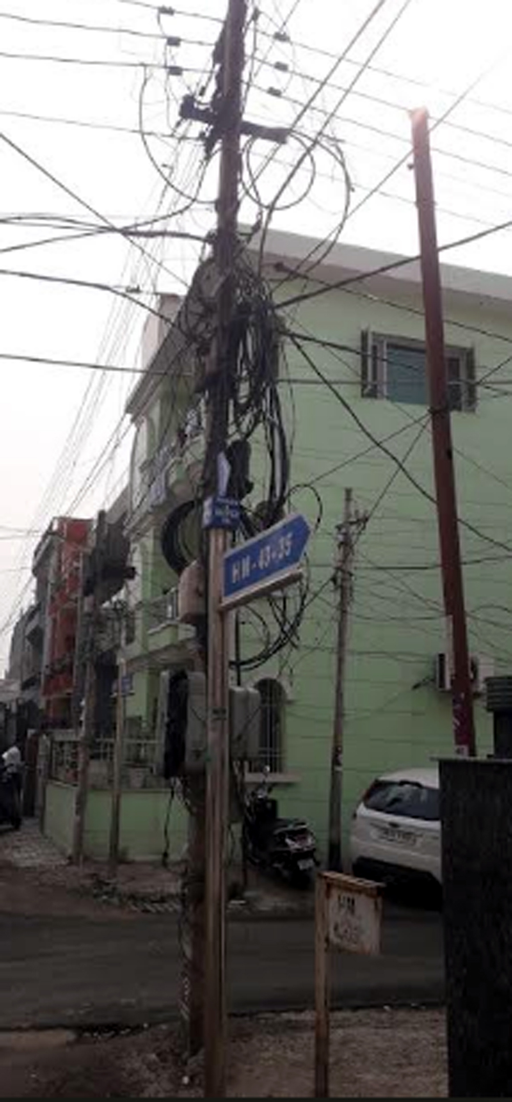 Demand to free the residents of HM Houses in Phase 4 from tangled electricity wires.